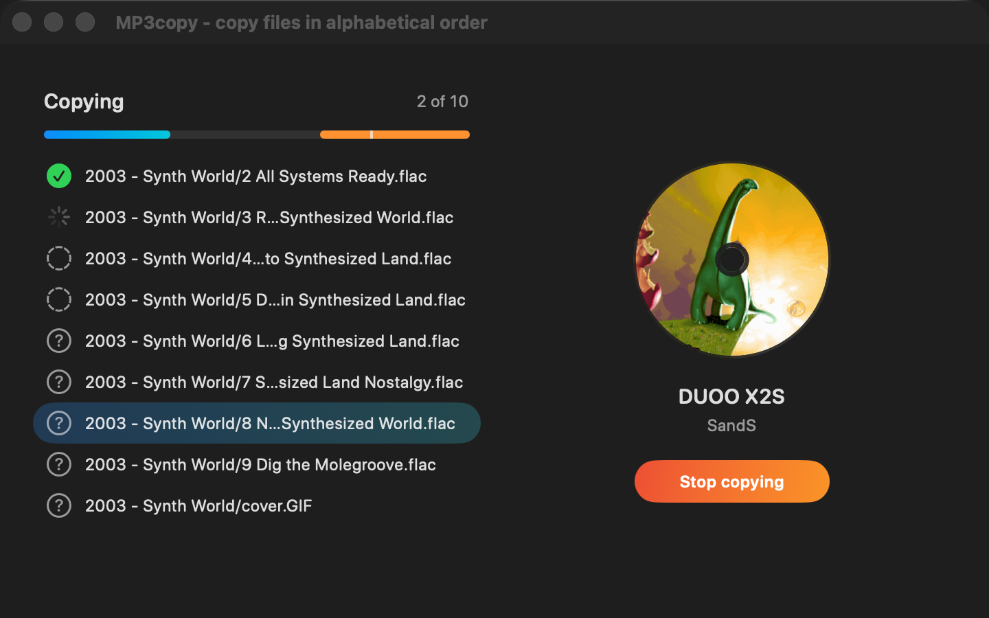 MP3copy copying an album: file list with statuses, progress bar and the spinning cover art